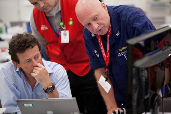 BP Group Chief Executive Tony Hayward discusses the operation with a US Coast Guard