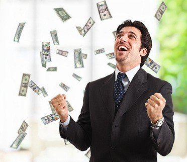 Happy man enjoying the rain of money