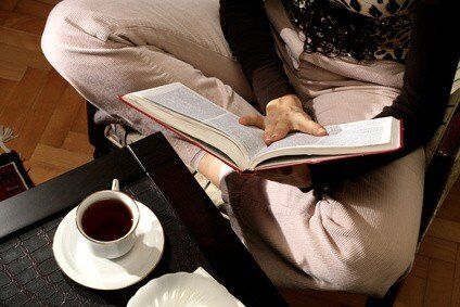 an image of a woman reading a book