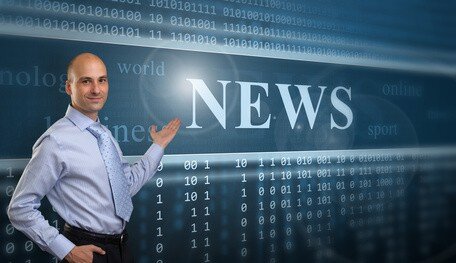 Person pointing to sign saying "News"