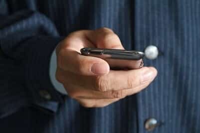 Touch screen mobile phone, in hand