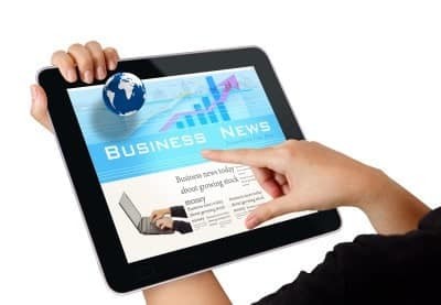hands touching tablet screen