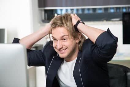 Man annoyed with computer