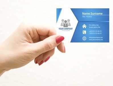 Woman holding a business card