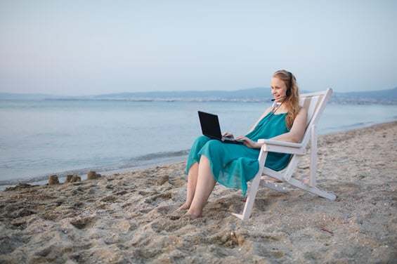 Woman working on the beach