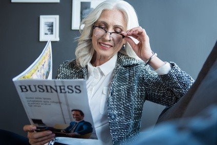 Woman reading business magazine