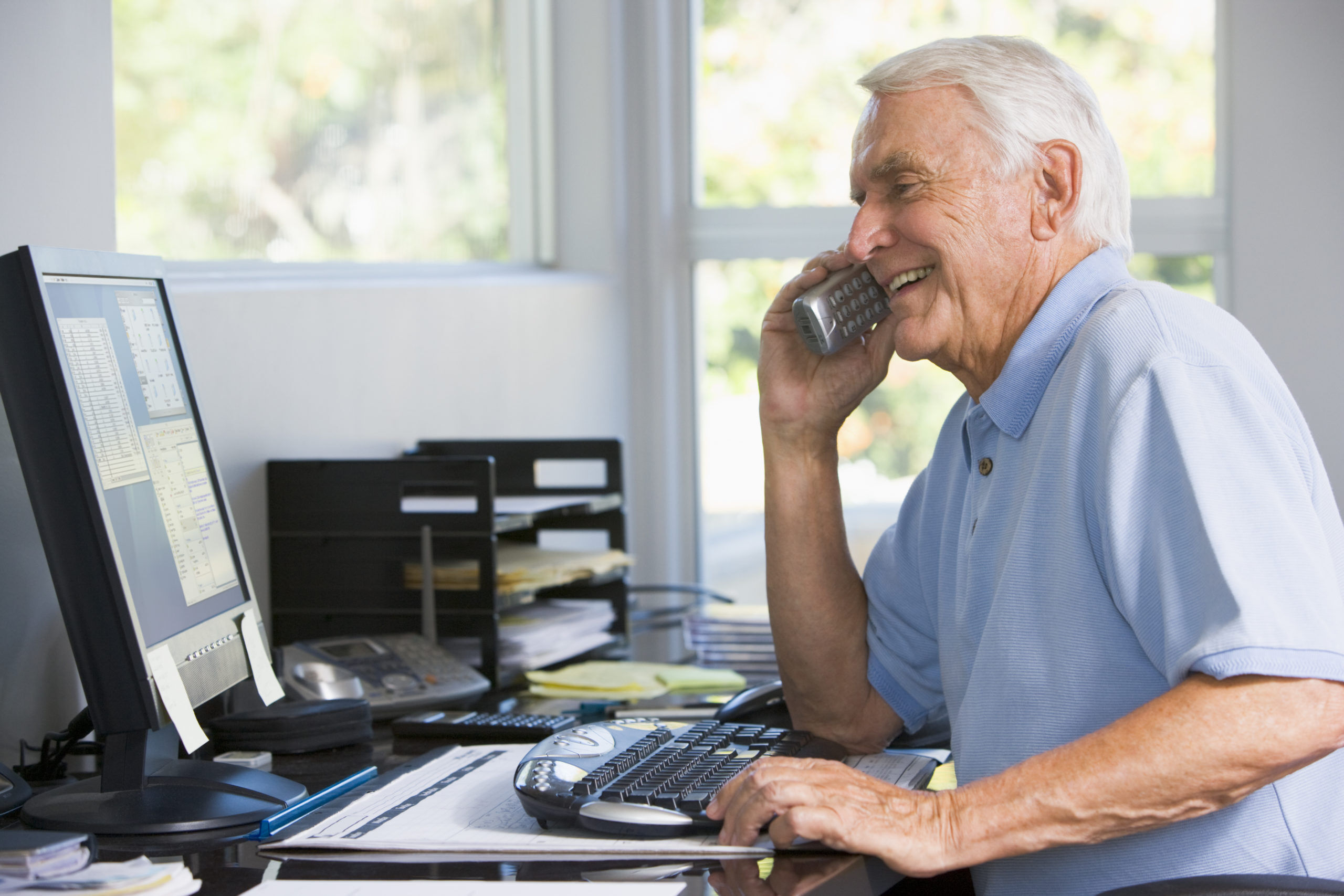 Man on phone selling and smiling