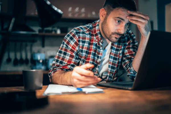 Man at computer in dark room
